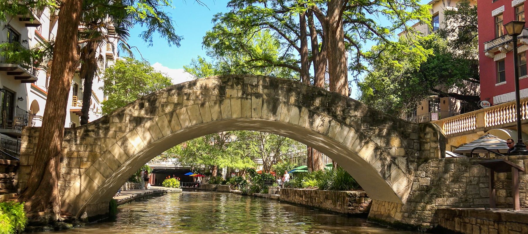 shot of archway over the san antonio river in alamo heights